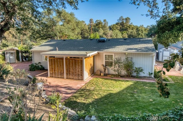 7695 Valle Ave, Atascadero, CA 93422 - view of front of house featuring a storage shed, a front lawn, a wooden deck, and roof with shingles