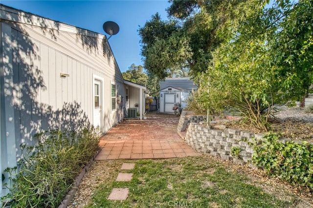 7695 Valle Ave, Atascadero, CA 93422 - view of yard featuring a storage unit and a patio area