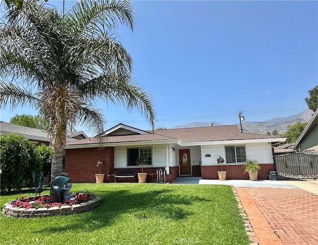 2415 Casa Grande St, Pasadena, CA 91104 - ranch-style home featuring brick siding and a mountain view
