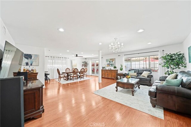 2415 Casa Grande St, Pasadena, CA 91104 - living area featuring light wood finished floors, a chandelier, and recessed lighting