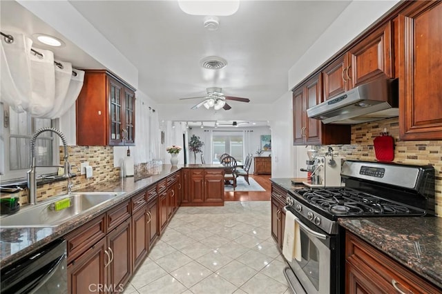 2415 Casa Grande St, Pasadena, CA 91104 - kitchen with gas stove, under cabinet range hood, dishwashing machine, tasteful backsplash, and ceiling fan