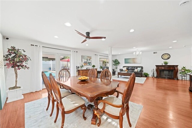 2415 Casa Grande St, Pasadena, CA 91104 - dining area with a glass covered fireplace, ceiling fan, light wood-style floors, and recessed lighting