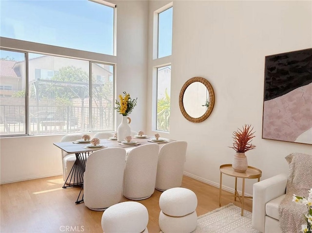 13128 Pintail Ct, Chino, CA 91710 - dining area with healthy amount of natural light and wood finished floors