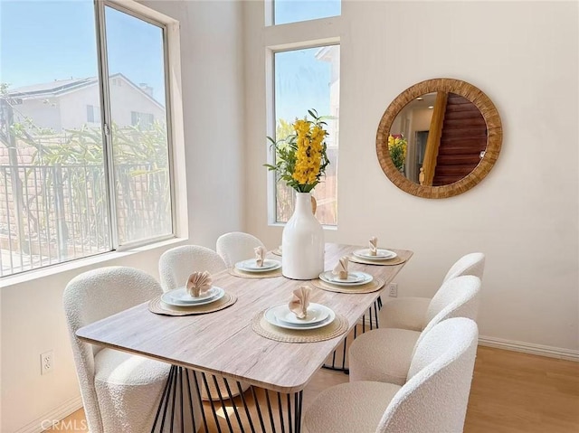 13128 Pintail Ct, Chino, CA 91710 - dining area featuring wood finished floors and baseboards