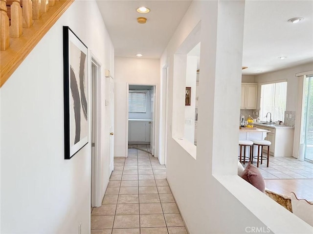 13128 Pintail Ct, Chino, CA 91710 - hall with light tile patterned floors and recessed lighting