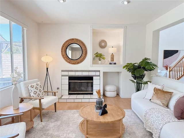 13128 Pintail Ct, Chino, CA 91710 - living area with wood finished floors, a tile fireplace, and recessed lighting