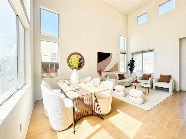 13128 Pintail Ct, Chino, CA 91710 - dining space with a high ceiling and wood finished floors