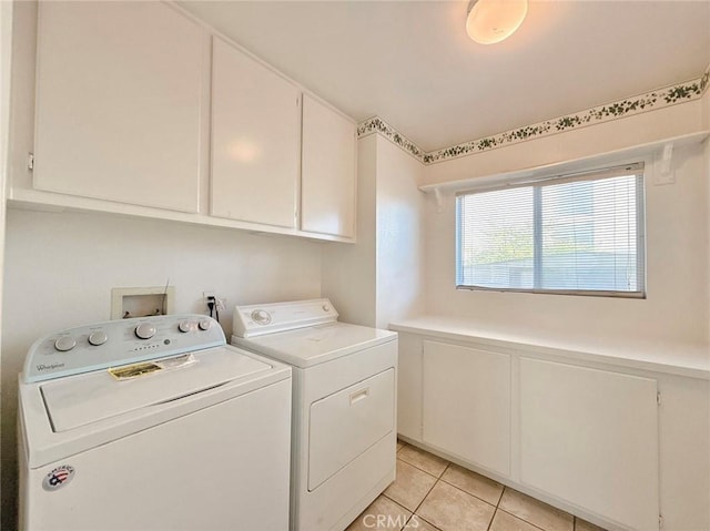 13128 Pintail Ct, Chino, CA 91710 - washroom with cabinet space, washer and dryer, light tile patterned floors, wainscoting, and a decorative wall