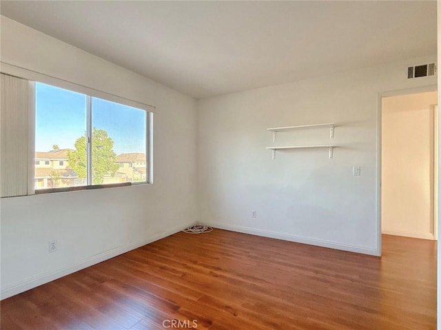 13128 Pintail Ct, Chino, CA 91710 - spare room with wood finished floors and baseboards