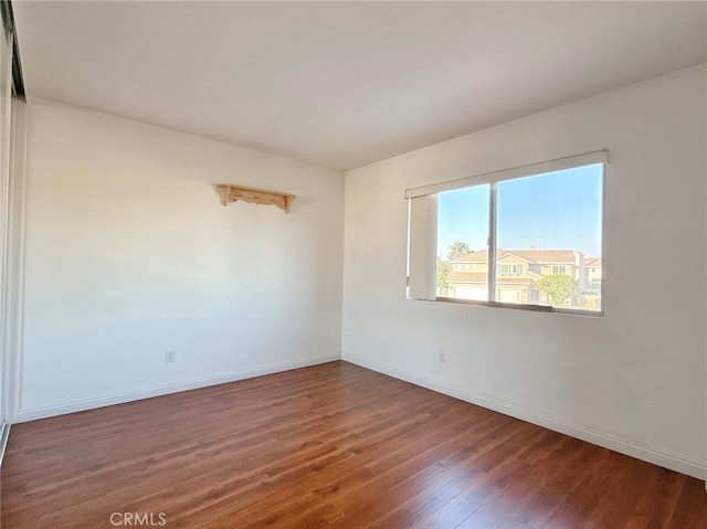 13128 Pintail Ct, Chino, CA 91710 - unfurnished room with wood finished floors and baseboards