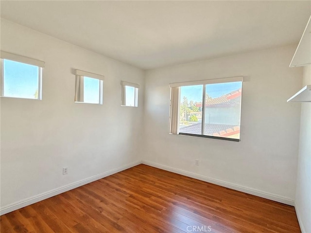 13128 Pintail Ct, Chino, CA 91710 - spare room featuring healthy amount of natural light and wood finished floors