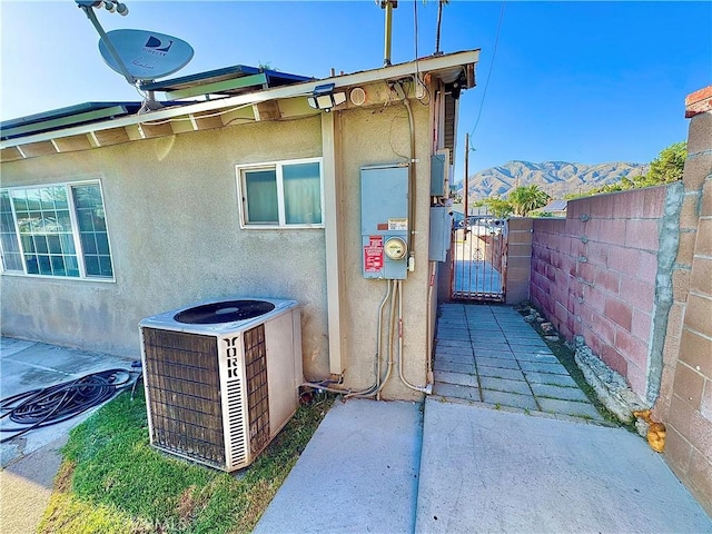 3425 Clifton Ave, Highland, CA 92346 - view of home's exterior featuring a gate, stucco siding, and a mountain view