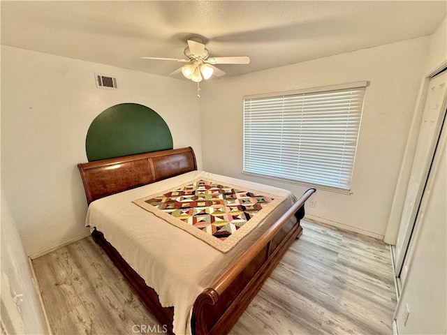 3425 Clifton Ave, Highland, CA 92346 - bedroom with light wood-style floors and ceiling fan
