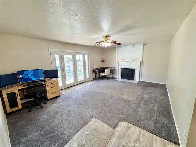 3425 Clifton Ave, Highland, CA 92346 - carpeted office space featuring french doors, ceiling fan, a textured ceiling, and a fireplace with flush hearth