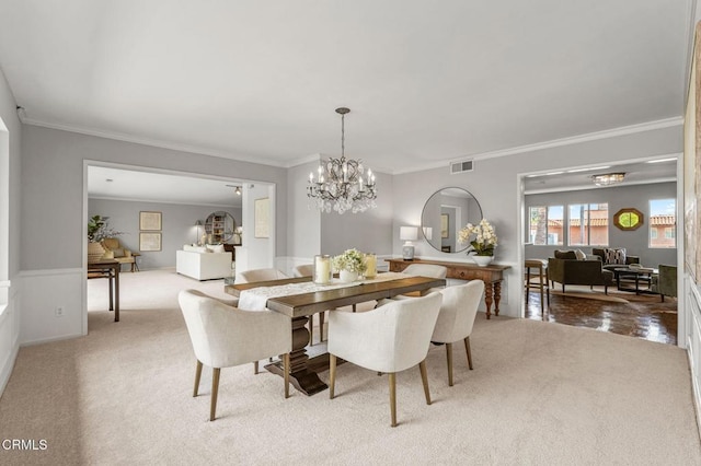 1200 S Orange Grove Blvd Unit 15, Pasadena, CA 91105 - carpeted dining space featuring ornamental molding and a chandelier