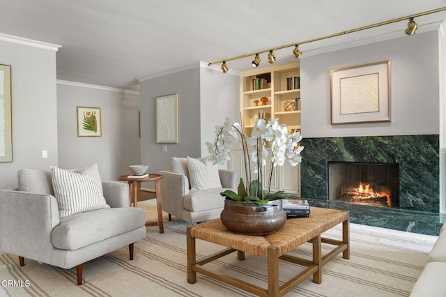 1200 S Orange Grove Blvd Unit 15, Pasadena, CA 91105 - living area with track lighting, a fireplace, crown molding, and light colored carpet