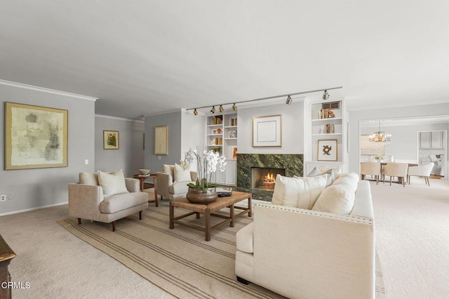 1200 S Orange Grove Blvd Unit 15, Pasadena, CA 91105 - living room with carpet, crown molding, a high end fireplace, and a chandelier
