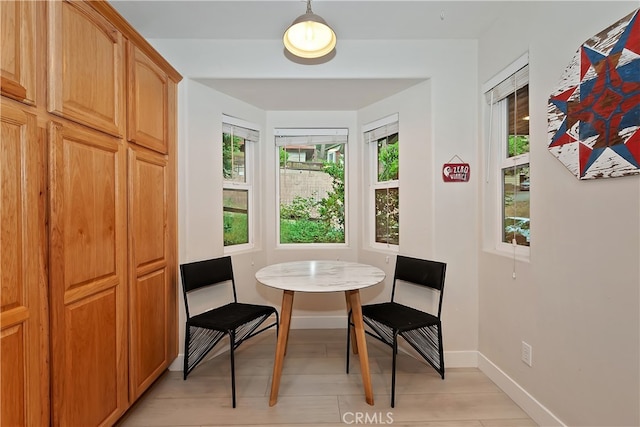 24586 Horst Dr, Crestline, CA 92325 - dining space with baseboards and light wood-style flooring