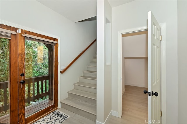 24586 Horst Dr, Crestline, CA 92325 - entryway featuring stairway and baseboards