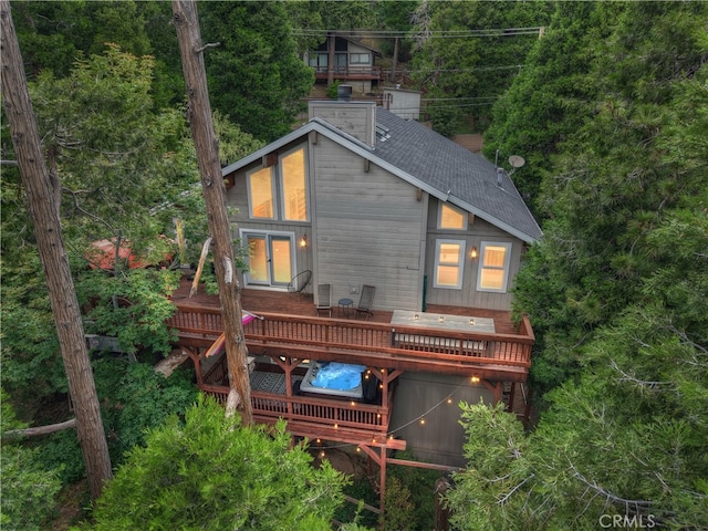24586 Horst Dr, Crestline, CA 92325 - rear view of property featuring a deck, a shingled roof, and a chimney