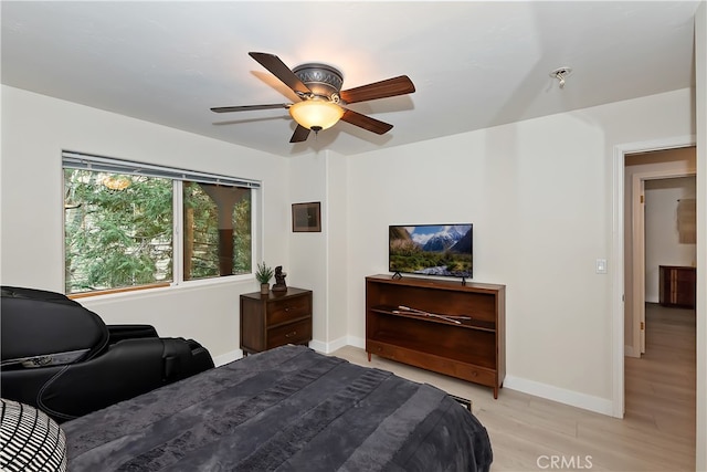 24586 Horst Dr, Crestline, CA 92325 - bedroom with light wood finished floors and a ceiling fan