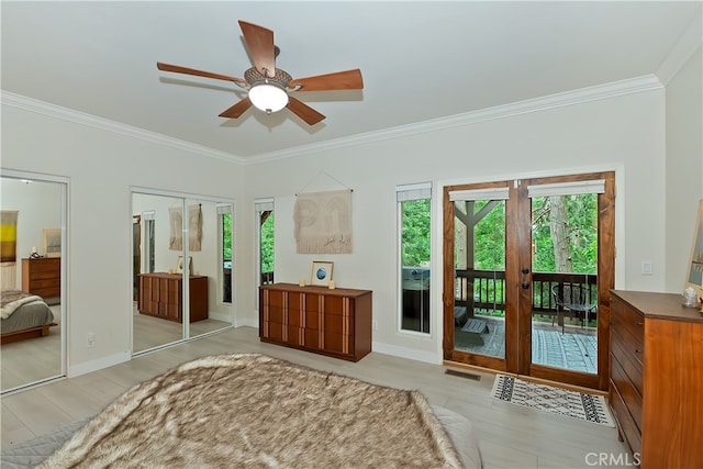 24586 Horst Dr, Crestline, CA 92325 - bedroom with light wood finished floors, crown molding, french doors, access to exterior, and two closets