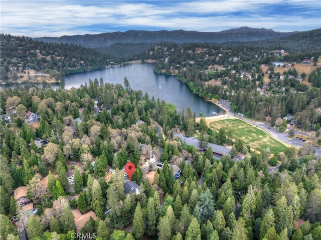 24586 Horst Dr, Crestline, CA 92325 - aerial overview of property's location with a water and mountain view and a heavily wooded area