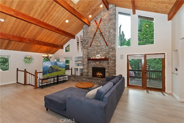 24586 Horst Dr, Crestline, CA 92325 - living room with high vaulted ceiling, light wood-style floors, a wood ceiling with exposed beams, a chandelier, and a stone fireplace