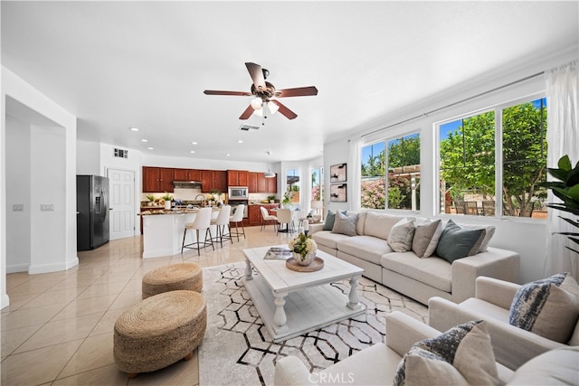 7265 Excelsior Dr, Eastvale, CA 92880 - living area with ceiling fan, light tile patterned floors, and recessed lighting