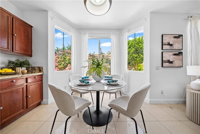 7265 Excelsior Dr, Eastvale, CA 92880 - dining area with healthy amount of natural light and light tile patterned floors