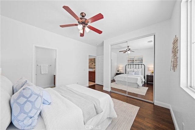 7265 Excelsior Dr, Eastvale, CA 92880 - bedroom with dark wood-style flooring, a closet, a ceiling fan, and connected bathroom