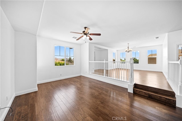 7265 Excelsior Dr, Eastvale, CA 92880 - unfurnished living room featuring a chandelier, a ceiling fan, and hardwood / wood-style floors