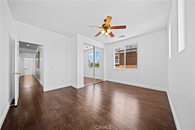 7265 Excelsior Dr, Eastvale, CA 92880 - unfurnished bedroom with dark wood finished floors, a ceiling fan, and a closet