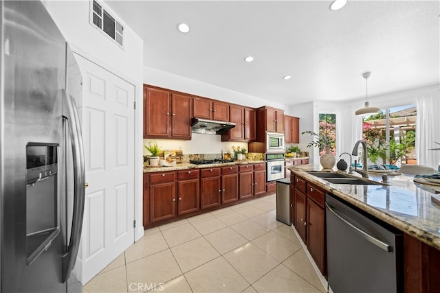 7265 Excelsior Dr, Eastvale, CA 92880 - kitchen featuring appliances with stainless steel finishes, under cabinet range hood, recessed lighting, light stone counters, and pendant lighting