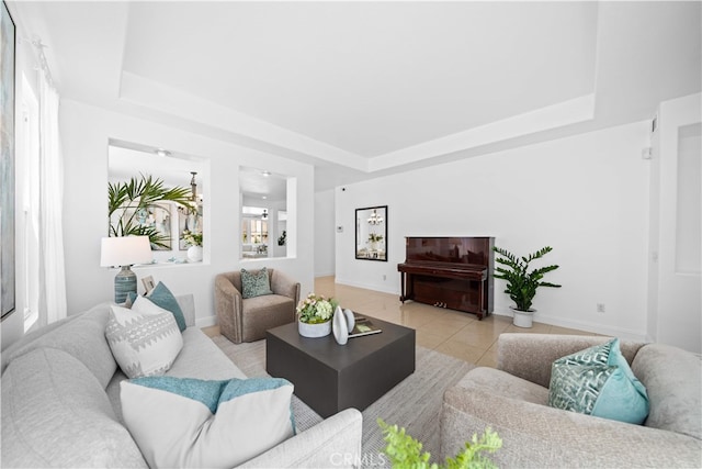 7265 Excelsior Dr, Eastvale, CA 92880 - living room with a tray ceiling and light tile patterned flooring