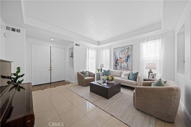 7265 Excelsior Dr, Eastvale, CA 92880 - living area featuring a raised ceiling and tile patterned flooring