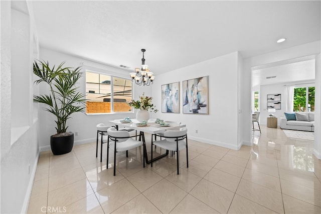 7265 Excelsior Dr, Eastvale, CA 92880 - dining space with light tile patterned flooring and a chandelier