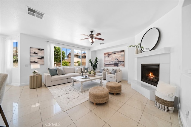 7265 Excelsior Dr, Eastvale, CA 92880 - living area featuring a ceiling fan, a fireplace, and light tile patterned flooring