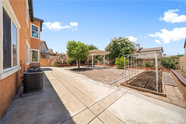 7265 Excelsior Dr, Eastvale, CA 92880 - fenced backyard featuring a vegetable garden, a patio, and a pergola