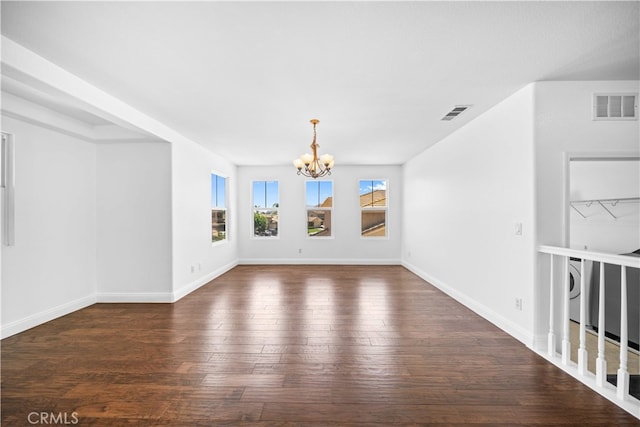 7265 Excelsior Dr, Eastvale, CA 92880 - unfurnished room with a chandelier, wood-type flooring, and washer / dryer