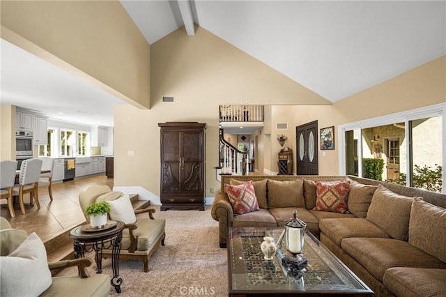 19180 Palm Vis, Yorba Linda, CA 92886 - living area featuring high vaulted ceiling, stairs, and beam ceiling