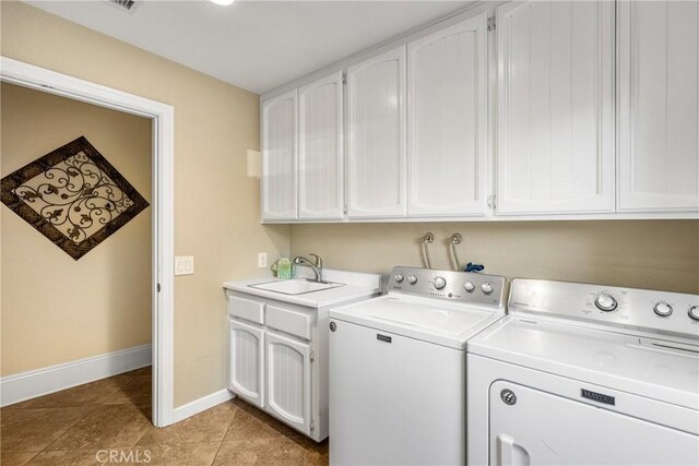 19180 Palm Vis, Yorba Linda, CA 92886 - laundry area featuring washing machine and dryer, cabinet space, and light tile patterned floors