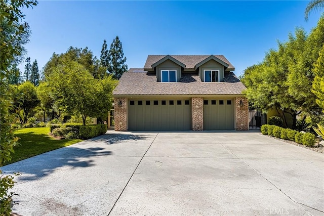 19180 Palm Vis, Yorba Linda, CA 92886 - view of front of home with brick siding, concrete driveway, and a garage