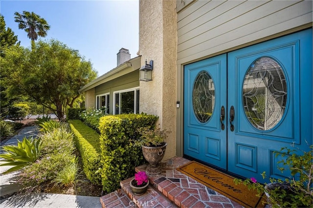 19180 Palm Vis, Yorba Linda, CA 92886 - entrance to property with a chimney, french doors, and stucco siding