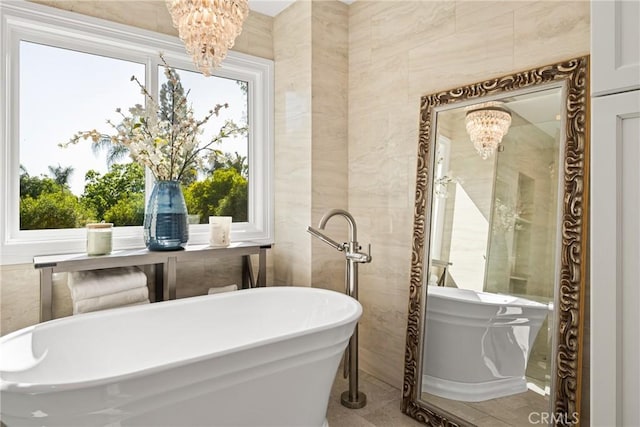 19180 Palm Vis, Yorba Linda, CA 92886 - full bath with a chandelier, a freestanding tub, plenty of natural light, and tile walls