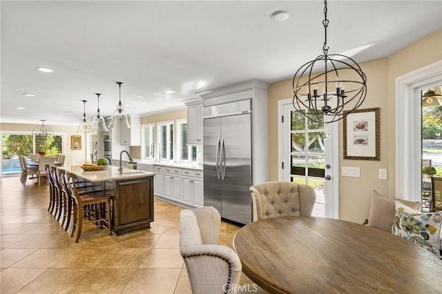 19180 Palm Vis, Yorba Linda, CA 92886 - dining space featuring a chandelier, light tile patterned floors, and recessed lighting
