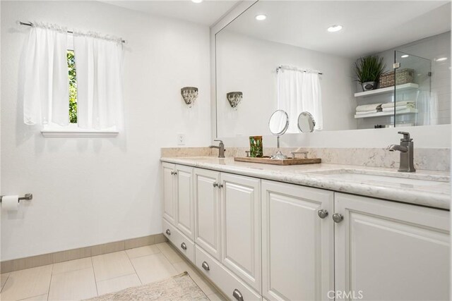 19180 Palm Vis, Yorba Linda, CA 92886 - bathroom featuring double vanity, a shower, tile patterned flooring, and recessed lighting