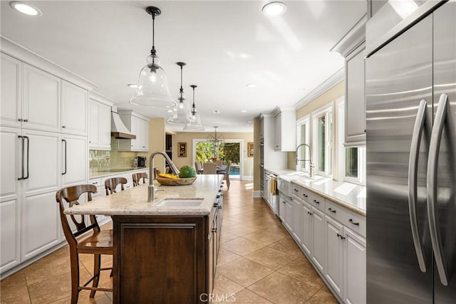 19180 Palm Vis, Yorba Linda, CA 92886 - kitchen with stainless steel fridge, premium range hood, a kitchen bar, tasteful backsplash, and white cabinets