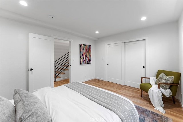 15016 Firmona Ave, Lawndale, CA 90260 - bedroom with recessed lighting, light wood-style flooring, and a closet