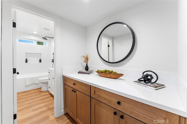 15016 Firmona Ave, Lawndale, CA 90260 - full bath featuring vanity, wood finished floors, and washtub / shower combination